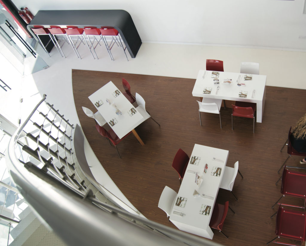 Interiors of Rossovivo Dubai Media City. Top camera shot of tables and chairs.