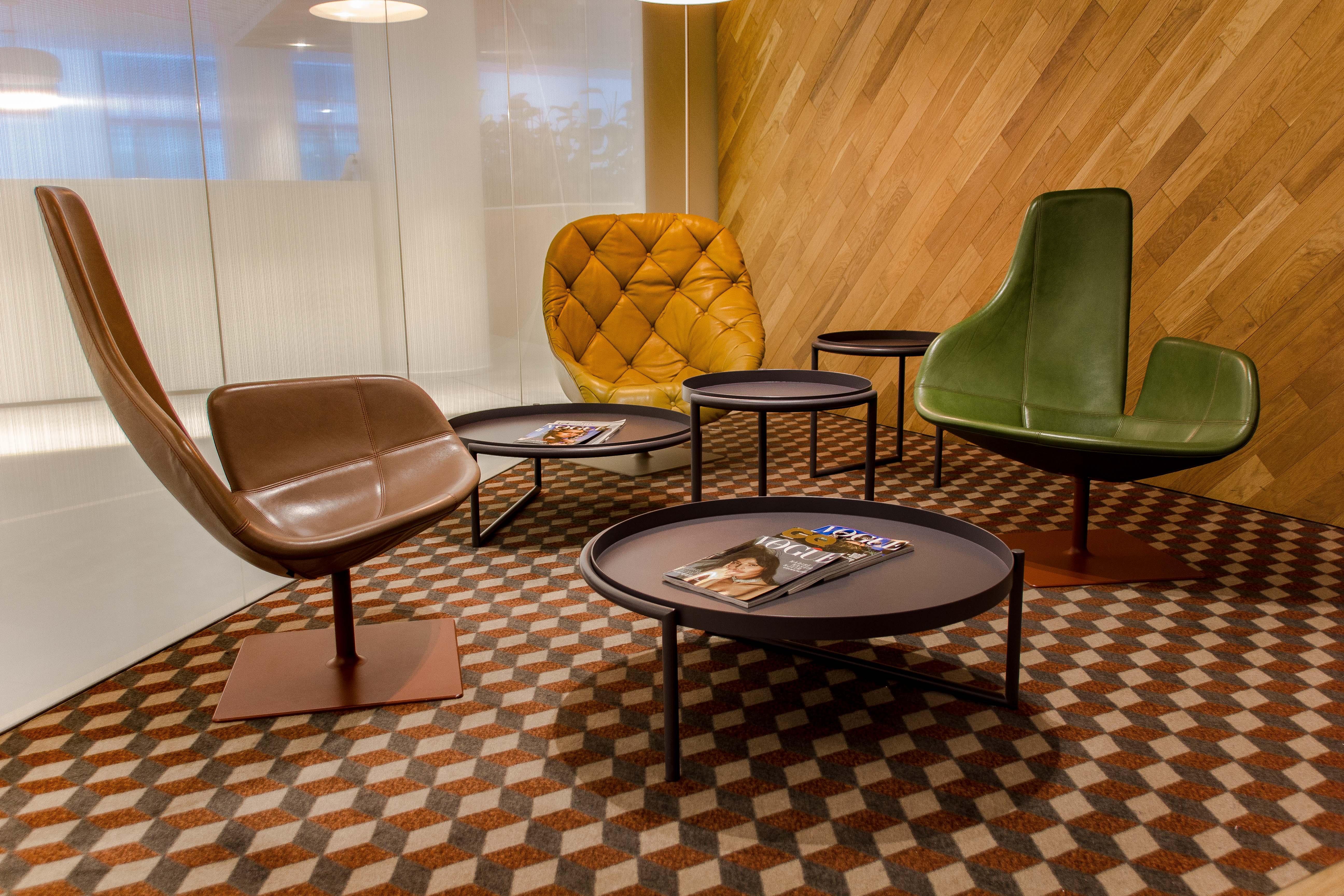 Tecom d3 headquarters office. Futuristic armchairs on brown floor.